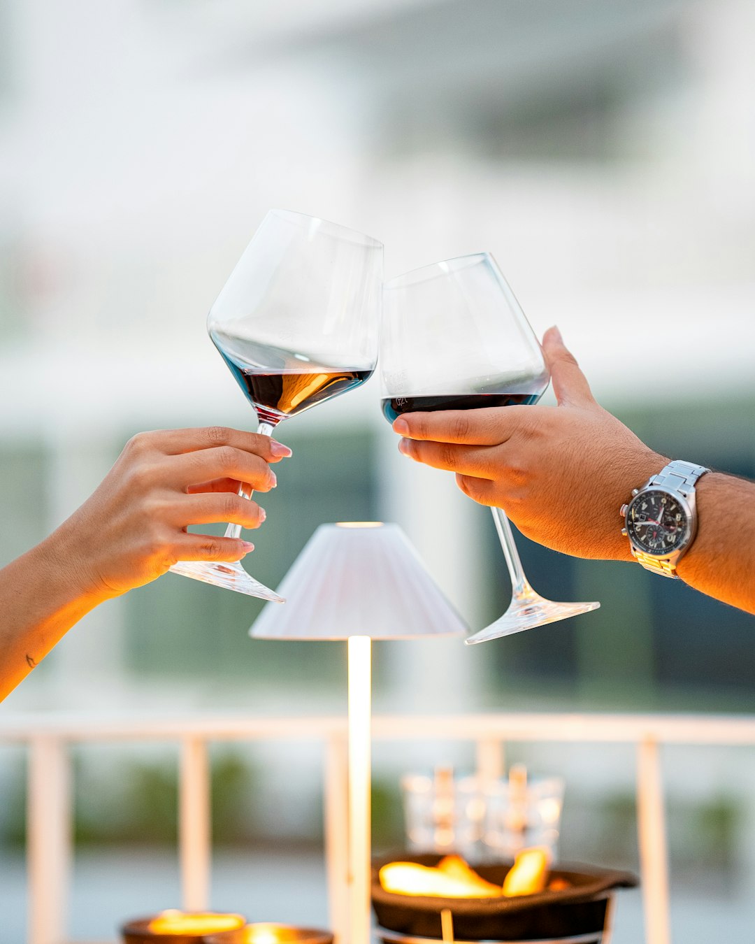 two-hands-clinking-wine-glasses-in-a-toast-vufpsn0op0k